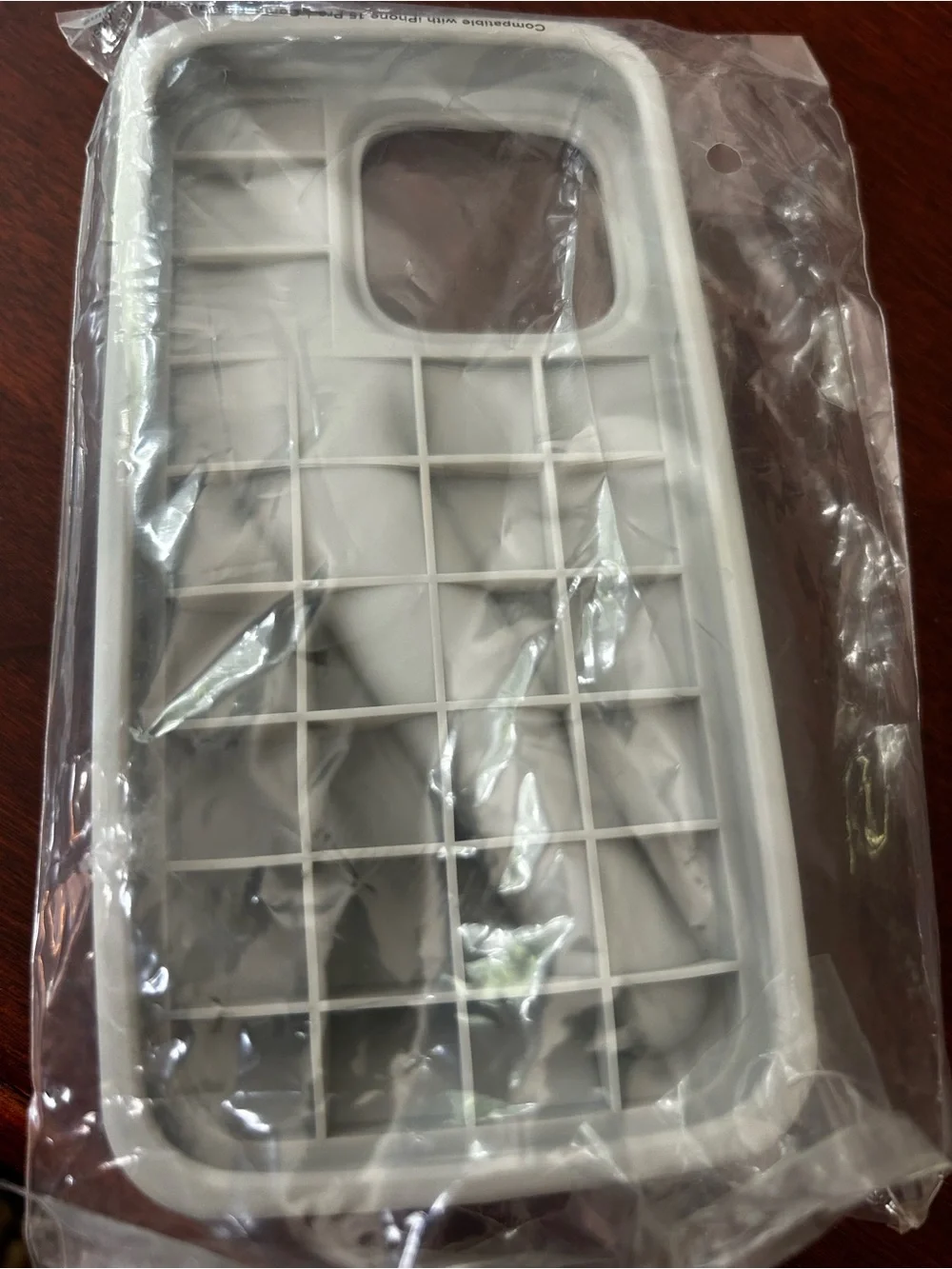 RHODE grey Silicone iPhone Case with Built-In lip gloss Loop